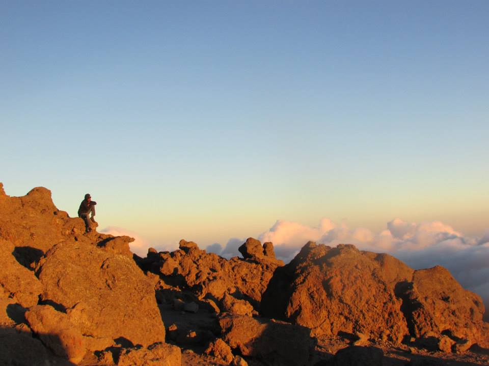 A Kilimanjaro porter, enjoying the view above the clouds at Barafu Camp, Kilimanjaro's base camp.